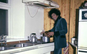 Jimi Hendrix cooking some food in his home 1969