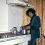 Jimi Hendrix cooking some food in his home 1969